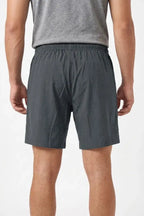 Rear view of men’s gray athletic shorts with elastic waistband